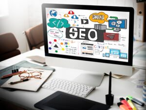 What is local SEO and why is it important? SEO concept displayed on a desktop computer with digital marketing icons, content, and web design illustrations.