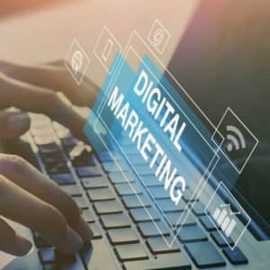 Digital marketing concept with hands typing on a laptop keyboard and digital marketing icons displayed on screen.